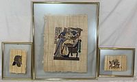Front view showing three framed papyrus artworks