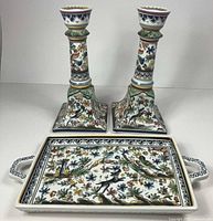 Front view of both candlesticks and handled tray