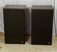 Speakers with grilles on, front view