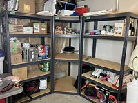 Three assembled metal shelving units forming an L-shape