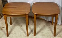 Front view of both matching wooden end tables
