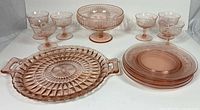 Entire set showing bowl, six glasses, platter, plates