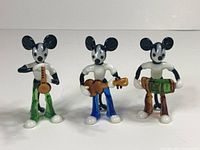 Group shot of three Bimini glass Mickey Mouse musician figurines