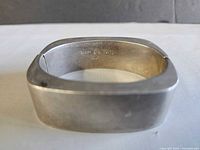 Overall view of sterling silver square bangle showing hallmark