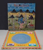 Both album jackets displayed; Little Creatures jacket upright, Speaking in Tongues jacket flat