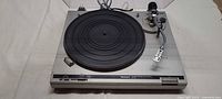 Full view of Technics SL-B2 turntable with dust cover raised
