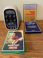 Front view of 8-track player with three cartridges