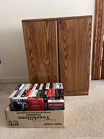 Cabinet with extra box of VHS tapes