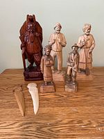 Group shot of all seven carvings on table