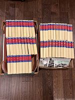 Two boxes containing uniform cream cloth Zane Grey hardcovers