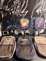 Five paddles upright, three cases in front