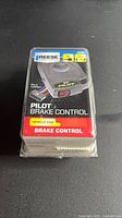 Front view of sealed Reese Towpower Pilot brake control package