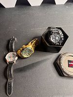 Overview of all three watches and G-Shock tin