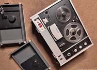 Top view of Sony TC-530 tape recorder with both detachable covers removed and placed nearby
