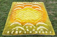 Full view of rug showing pattern and colours