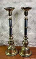 Front view of both brass candlesticks