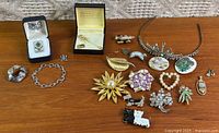 Full layout showing all jewellery pieces on table