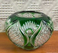 Front view of green cut-to-clear glass bowl