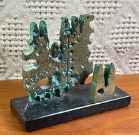 Front view of bronze sculpture on marble base