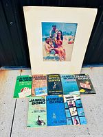 Group shot of matted photo and six paperback novels