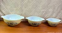 All three Pyrex Homestead Cinderella bowls nested side by side