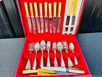 Open chest showing all flatware pieces in situ