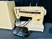 Singer Stylist 513 sewing machine with pedal and case
