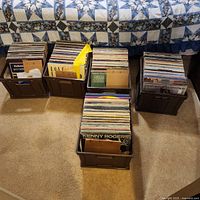 Four crates of vinyl LP records on carpet