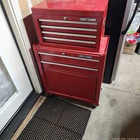 Full view of stacked red Craftsman tool chest in garage corner