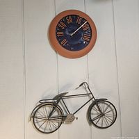 Wall thermometer and bicycle decor on wall