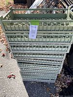 stack of ten green plastic bulb drying trays
