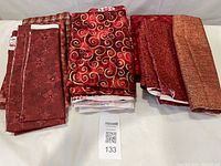 All five fabric cuts folded on table