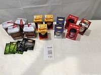 Group shot showing all boxed ornaments, tea tins and tea bags