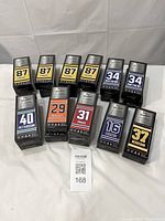 Group shot of 20 boxed mini sticks showing player numbers and names