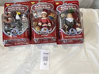 Front view of the three sealed action figures