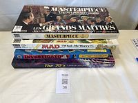 Stacked view of all four boxed board games