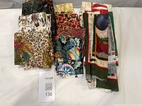 Stacked assorted Christmas fabrics and panels