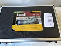 Closed aluminium case with Bushnell Trophy label