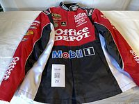 Front view of jacket laid flat showing logos, color scheme and overall condition