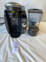 Coffee maker with reservoir and drip tray front view