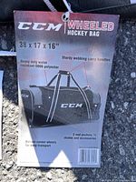 Retail tag showing CCM wheeled hockey bag specs