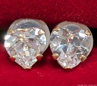 Front view of both pear-cut CZ earrings showing stones and prong settings