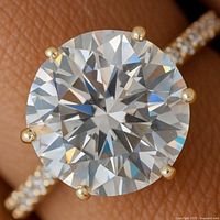 Top view highlighting round moissanite and prongs