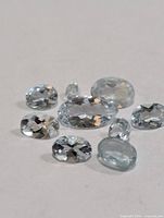 Group of nine loose aquamarine gemstones