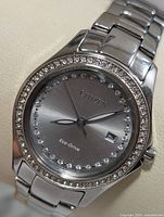 Front view showing dial, crystal bezel, bracelet