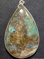 Front view of teardrop gemstone pendant in silver bezel