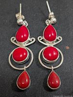 Front view of both earrings showing stone arrangement and silver settings