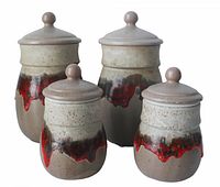 All four Laurentian Pottery canisters grouped