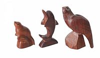 Front view of all three wooden animal sculptures