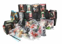 Stack of boxed toys with bagged toys spread in front